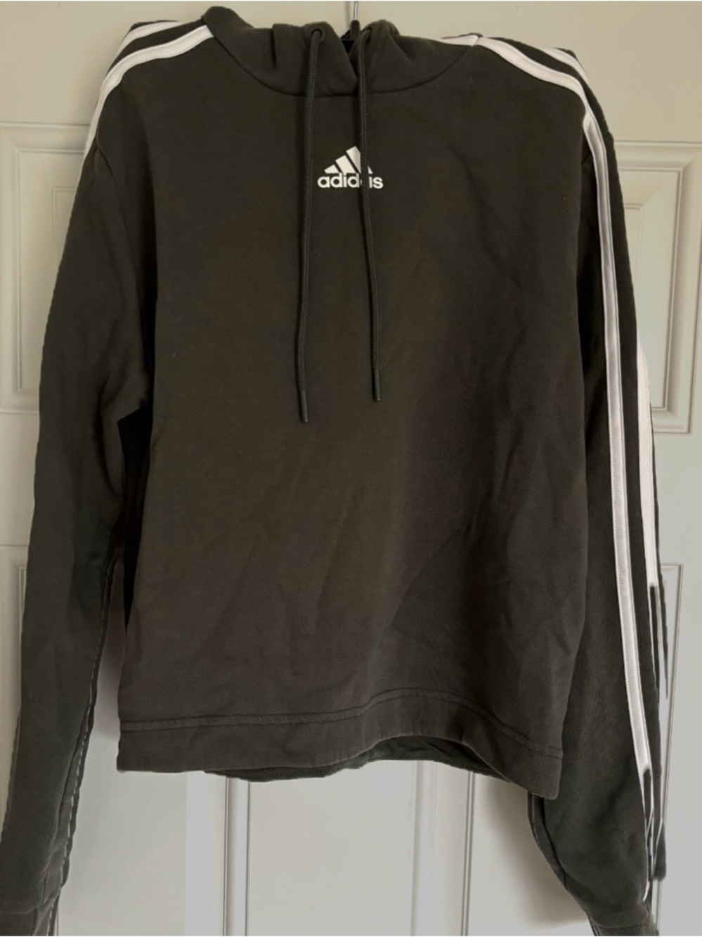Adidas women’s cropped hoodie in olive green with White Stripes